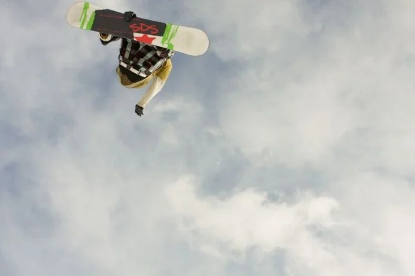 snowboarder aerial spin trick